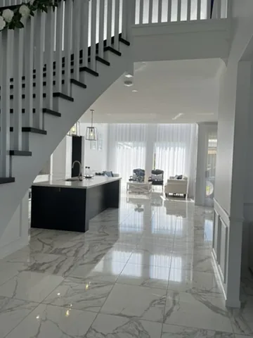 Freshly cleaned open-plan living area with polished floors