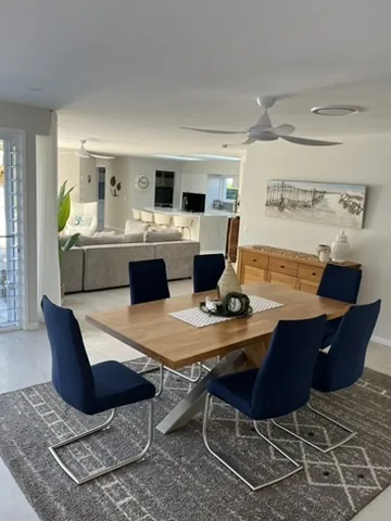 Clean dining and living area with tidy floors and surfaces